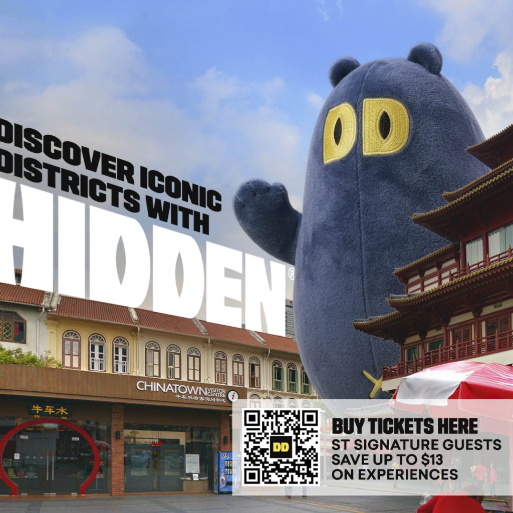 Discover Iconic Districts with HIDDEN promotion featuring the HIDDEN mascot in front of Chinatown Visitor Centre with a QR code for discounted tickets
